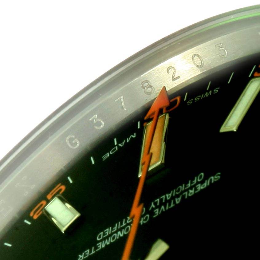 This close-up angle shows the orange lightning bolt second hand and part of the bezel on a Rolex Milgauss 116400V Men's Stainless Steel Black Dial 116400V Men's Stainless Steel Black Dial watch.