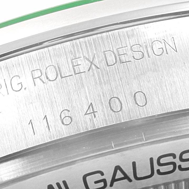 This image shows a close-up of the case and bezel of a Rolex Milgauss 116400GV Men's Stainless Steel Blue Dial 116400GV Men's Stainless Steel Blue Dial watch with model number 116400 engraved on it.