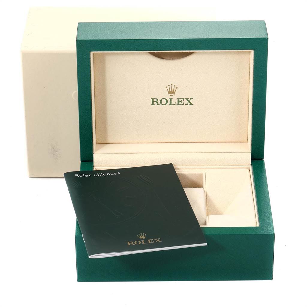 The image shows a Rolex Milgauss 116400GV Men's Stainless Steel Blue Dial 116400GV Men's Stainless Steel Blue Dial watch box, with an instruction booklet placed in front of it.