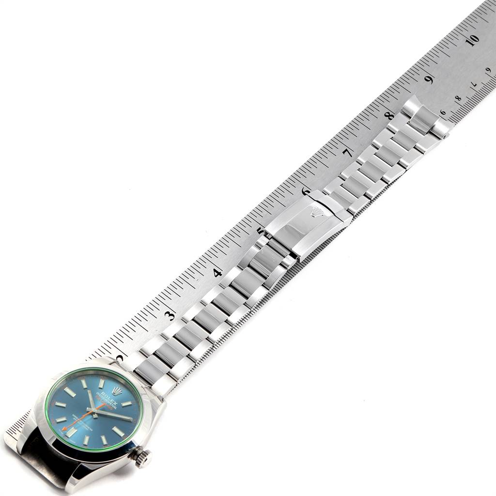 This image shows a top-down view of a Rolex Milgauss 116400GV Men's Stainless Steel Blue Dial 116400GV Men's Stainless Steel Blue Dial watch with its metal bracelet aligned next to a ruler for measurement.