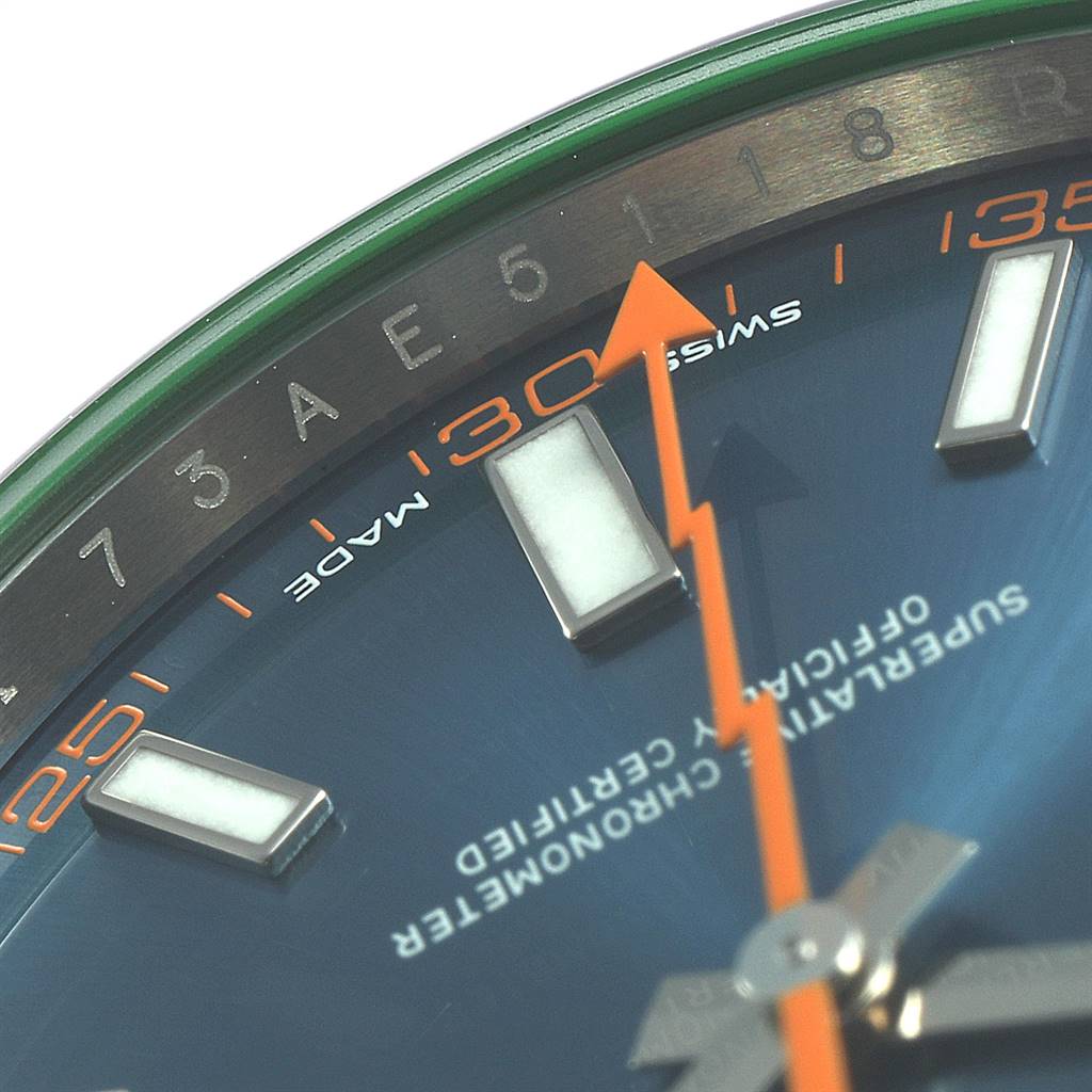 The image shows a close-up of the dial and orange second hand of a Rolex Milgauss 116400GV Men's Stainless Steel Blue Dial 116400GV Men's Stainless Steel Blue Dial watch, highlighting the hour markers and the text "Swiss Made."