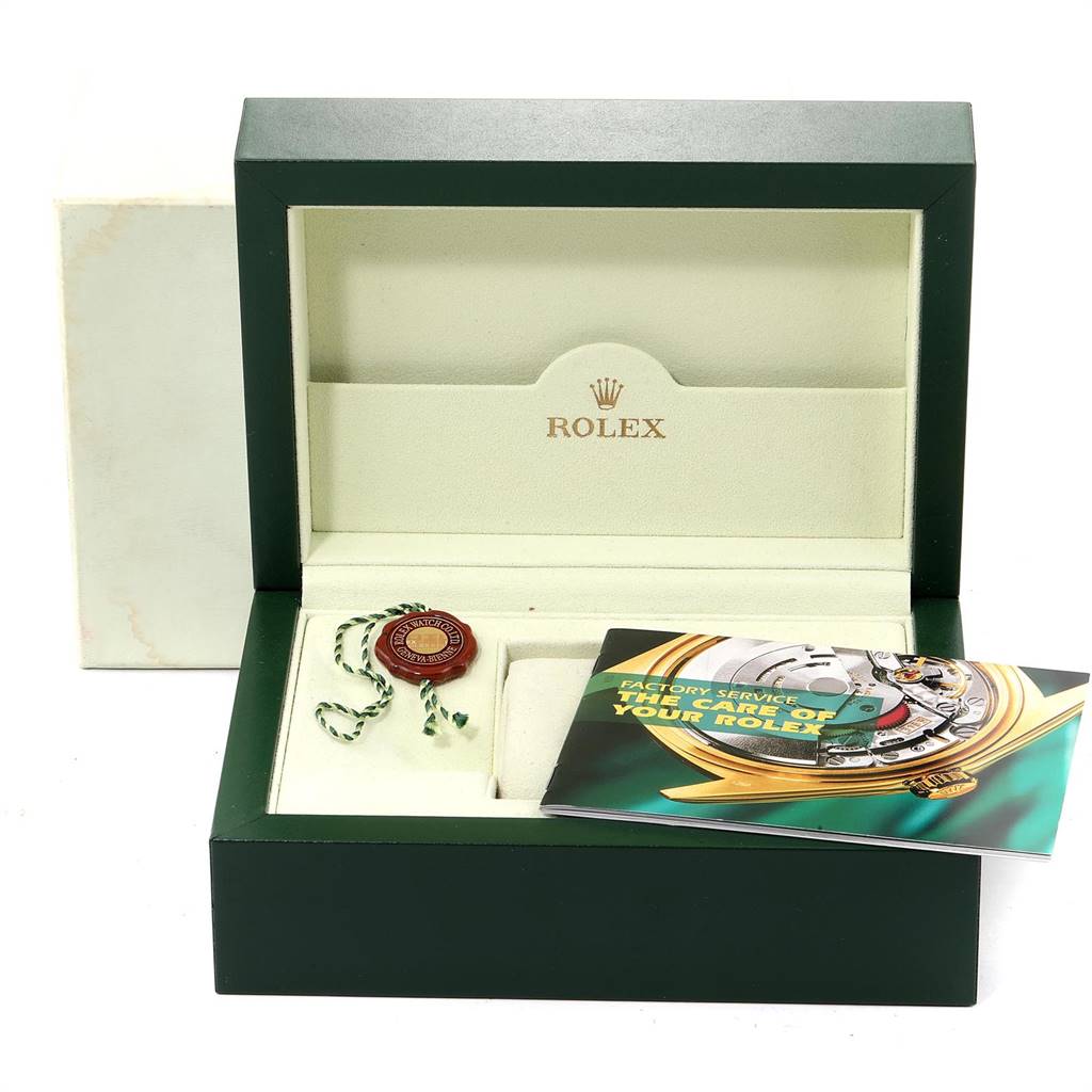 The image shows an open Rolex watch box for the Milgauss model, with an included booklet and hang tag but no watch inside.