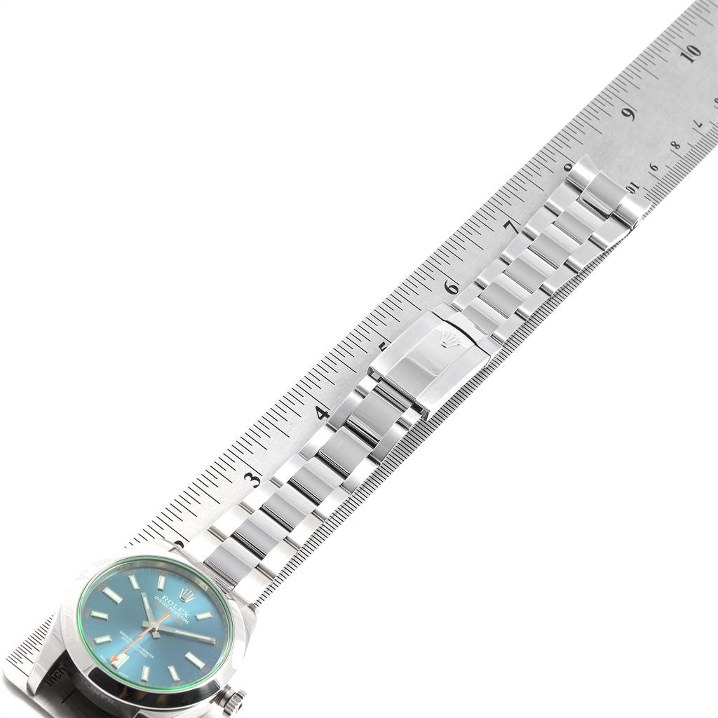 The image shows a Rolex Milgauss 116400GV Men's Stainless Steel Blue Dial 116400GV Men's Stainless Steel Blue Dial watch placed alongside a ruler, displaying the watch face and bracelet.