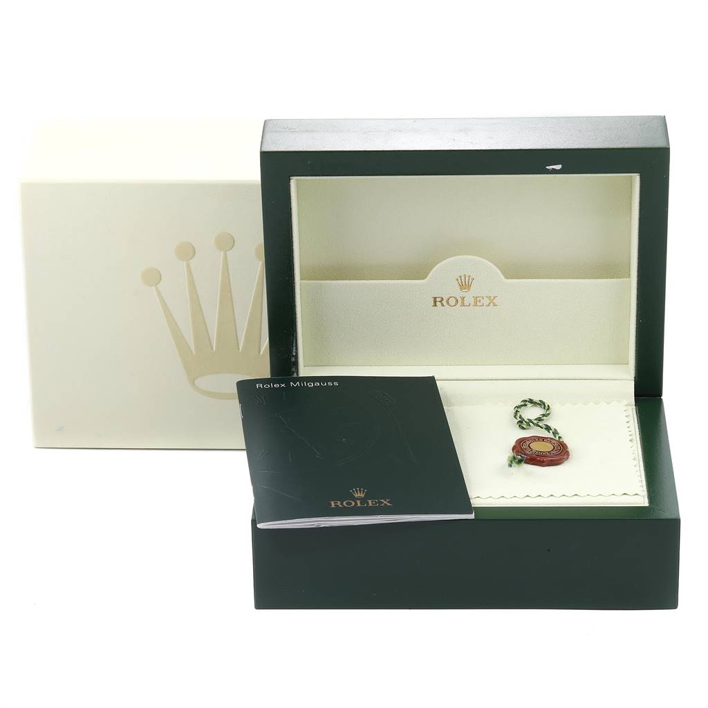 The image shows the packaging and accessories for a Rolex Milgauss 116400 Men's Stainless Steel Black Dial 116400 Men's Stainless Steel Black Dial watch, including the box, booklet, and tag.