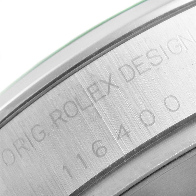 This image shows a close-up view of the engraved case back of a Rolex Milgauss watch, highlighting the model number 116400.