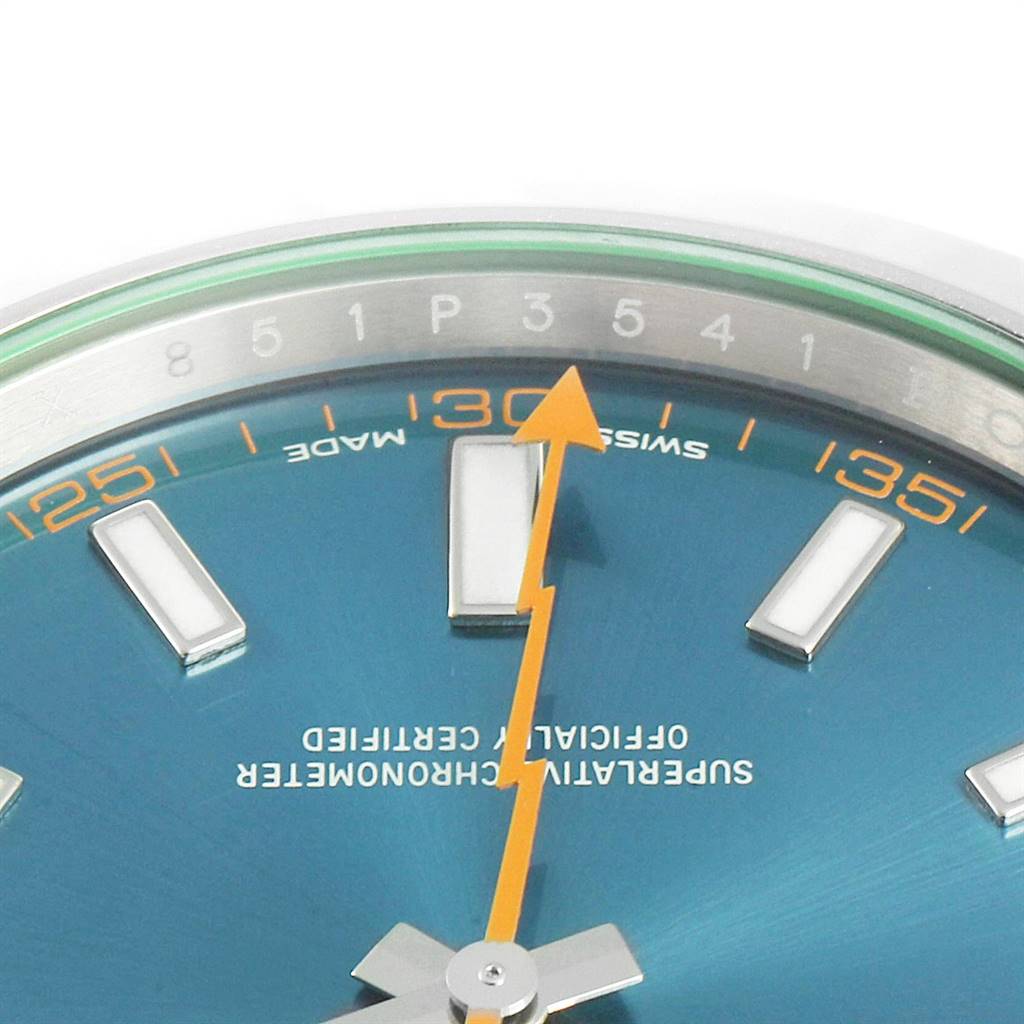 This close-up image of the Rolex Milgauss 116400GV Men's Stainless Steel Blue Dial 116400GV Men's Stainless Steel Blue Dial watch shows the orange lightning bolt second hand and part of the blue dial with hour markers.