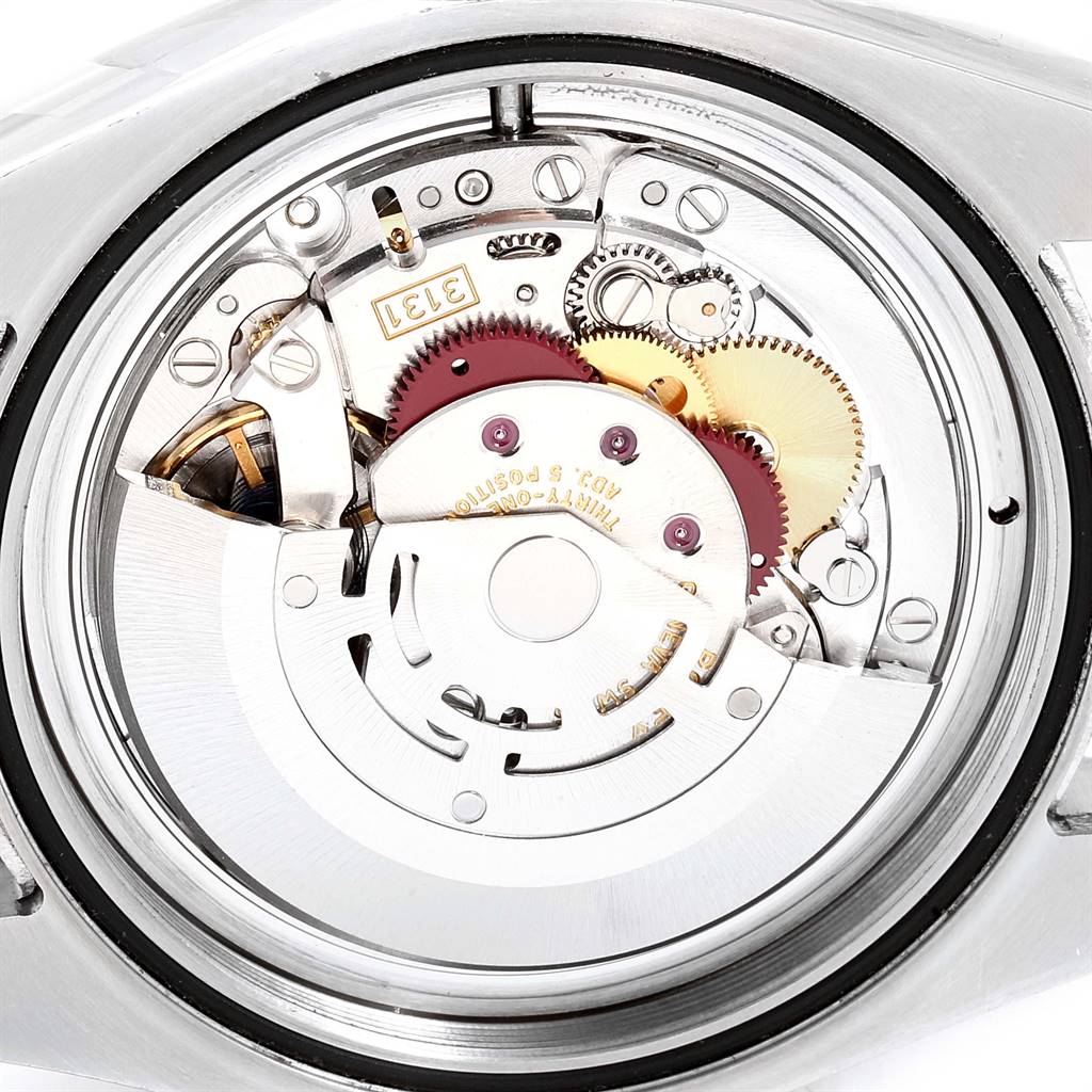 This image shows the internal movement mechanism of the Rolex Milgauss 116400V Men's Stainless Steel Black Dial 116400V Men's Stainless Steel Black Dial watch from a rear angle, featuring gears and mechanical components.