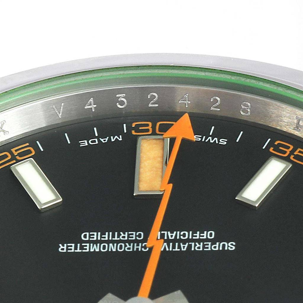 Close-up of the Rolex Milgauss 116400GV Men's Stainless Steel Black Dial 116400GV Men's Stainless Steel Black Dial watch face, showing the orange lightning bolt second hand, hour markers, minute indices, and partial text.