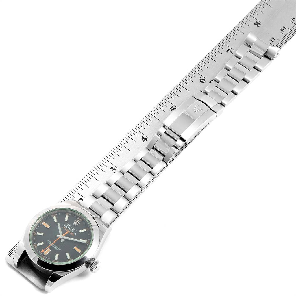 The image shows a top-down view of a Rolex Milgauss 116400GV Men's Stainless Steel Black Dial 116400GV Men's Stainless Steel Black Dial watch, with the dial, bezel, and bracelet clearly visible, placed next to a ruler.