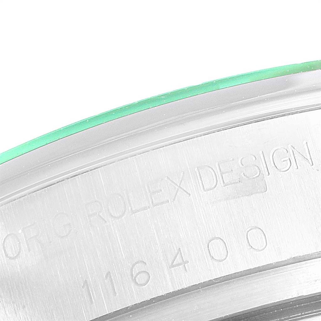 The image shows a close-up of the serial number engraving on the caseback edge of a Rolex Milgauss 116400V Men's Stainless Steel Black Dial 116400V Men's Stainless Steel Black Dial watch.