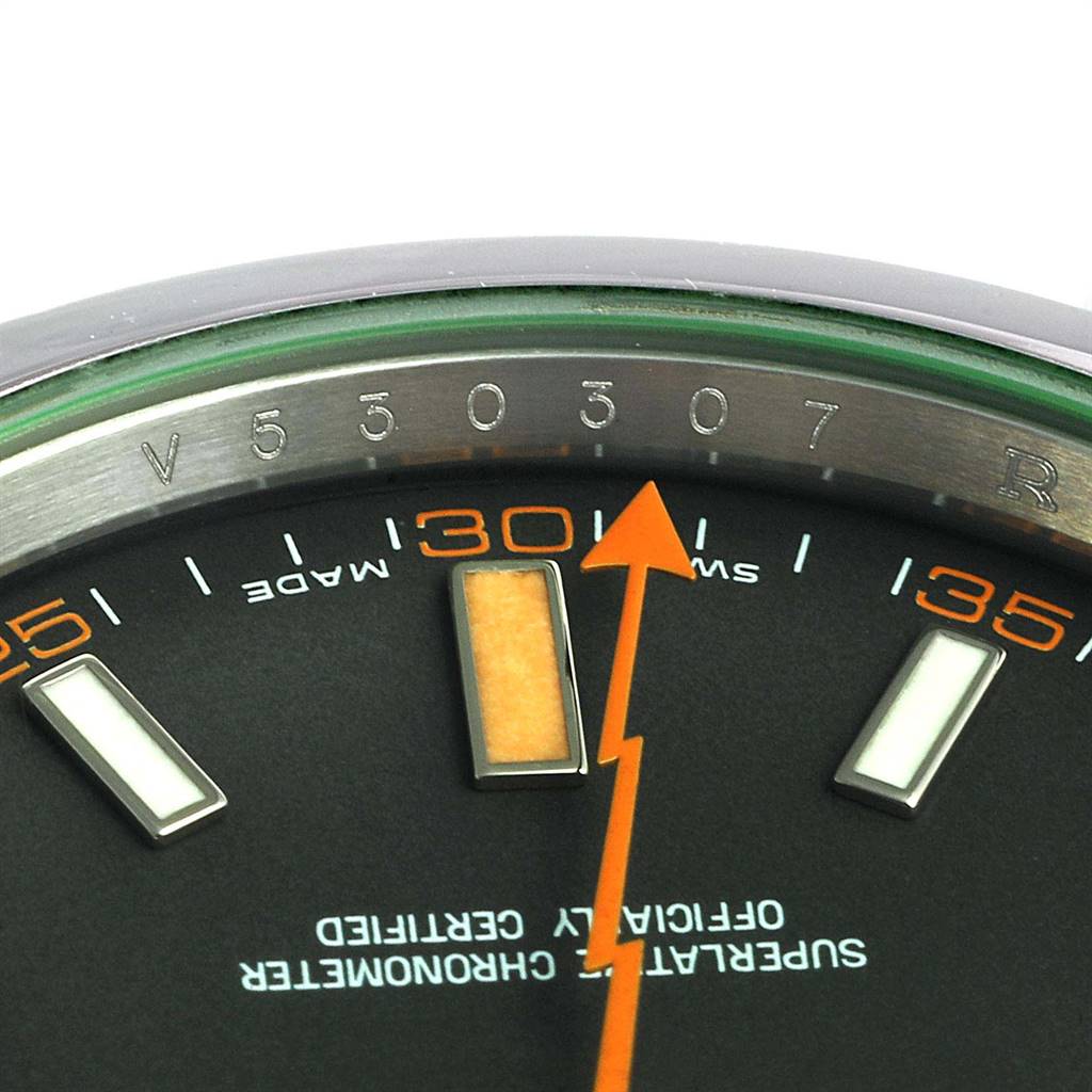 The image shows a close-up of the dial and orange seconds hand of a Rolex Milgauss 116400V Men's Stainless Steel Black Dial 116400V Men's Stainless Steel Black Dial watch.