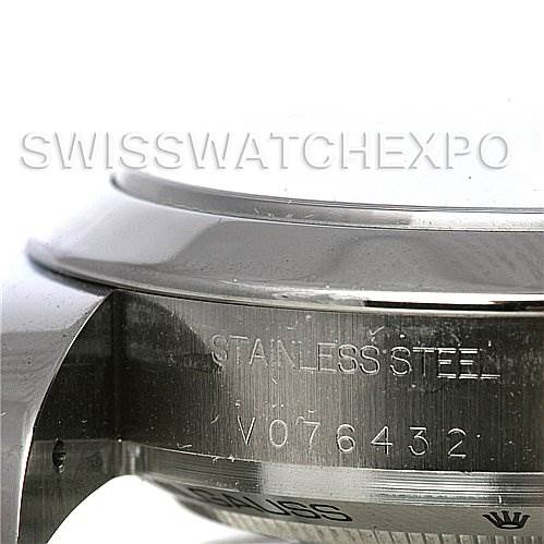 The image shows a close-up of the side of a Rolex Milgauss 116400BKSO Men's Stainless Steel Black Dial 116400BKSO Men's Stainless Steel Black Dial watch case, highlighting the "STAINLESS STEEL" and serial number engraving.