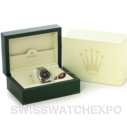 The image shows a Rolex Milgauss 116400BKSO Men's Stainless Steel Black Dial 116400BKSO Men's Stainless Steel Black Dial watch from a 3/4 angle, displayed in an open green Rolex box with a cream outer box beside it.