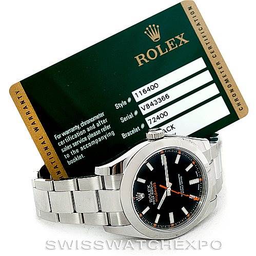 The image shows a Rolex Milgauss 116400 Men's Stainless Steel Black Dial 116400 Men's Stainless Steel Black Dial watch at a slight angle and includes its warranty card with model and serial numbers visible.