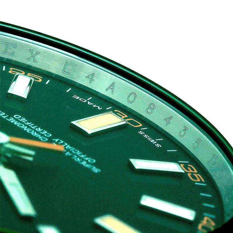 The image shows a close-up angle of the Rolex Milgauss 116400V Men's Stainless Steel Black Dial 116400V Men's Stainless Steel Black Dial watch dial, including part of the bezel and engraved details.