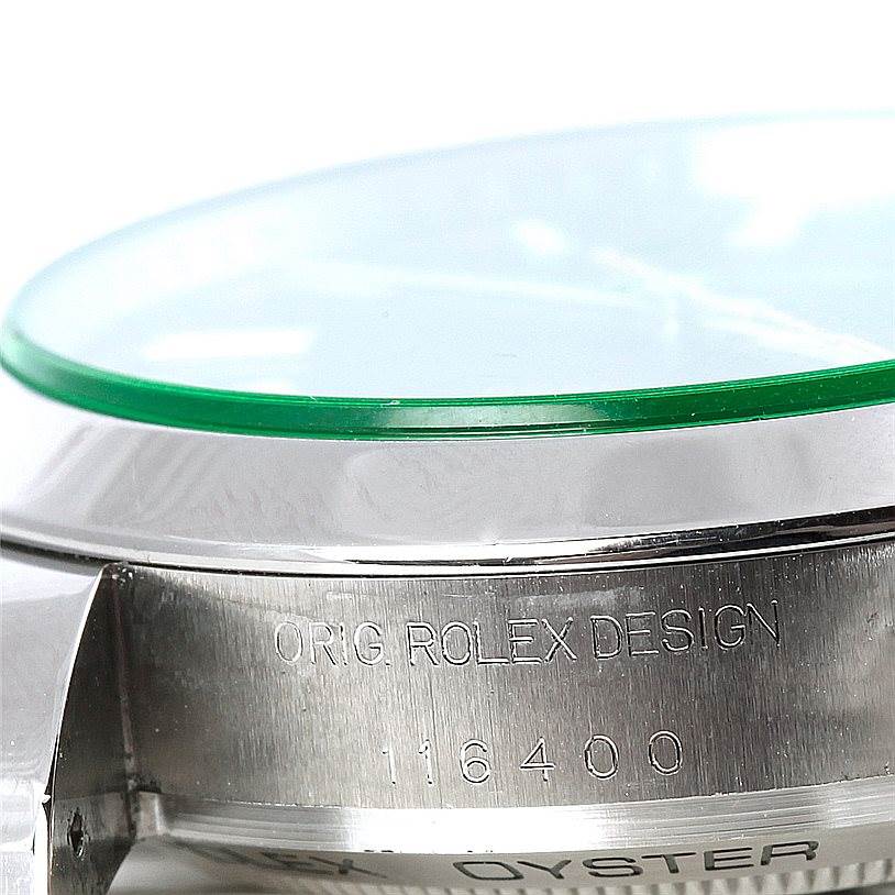 The image shows a close-up angle of the side of a Rolex Milgauss 116400V Men's Stainless Steel Black Dial 116400V Men's Stainless Steel Black Dial watch, displaying the model number 116400 and "ORIG ROLEX DESIGN" engraving.