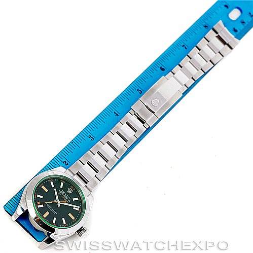 The image shows a Rolex Milgauss 116400V Men's Stainless Steel Black Dial 116400V Men's Stainless Steel Black Dial watch with the entire bracelet placed alongside a blue ruler for scale.