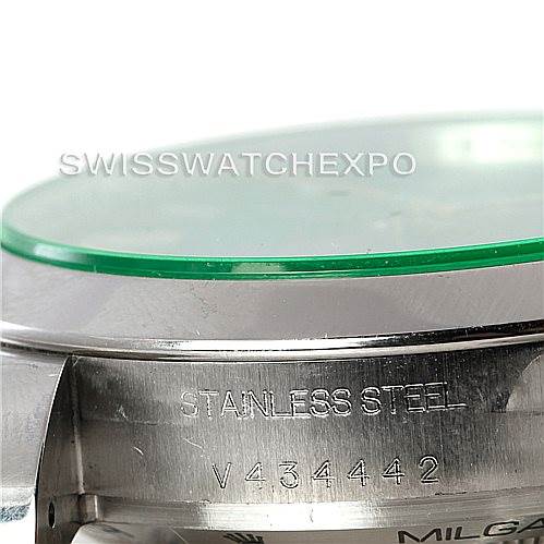 The image shows a close-up side view of a Rolex Milgauss 116400V Men's Stainless Steel Black Dial 116400V Men's Stainless Steel Black Dial watch case, focusing on the "Stainless Steel" engraving and serial number.