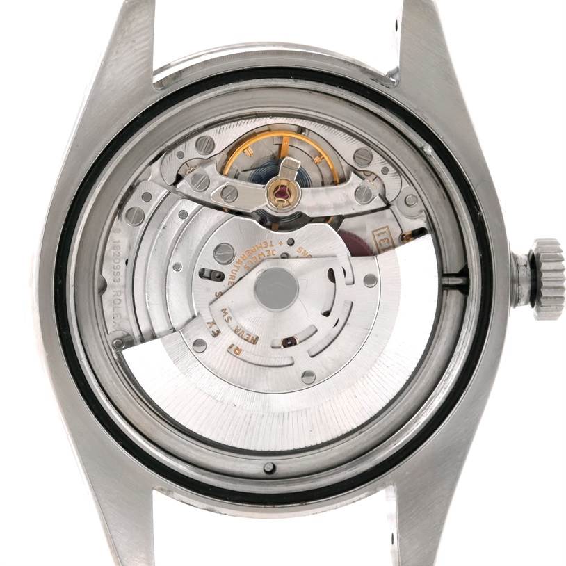 This image shows the back view of a Rolex Milgauss 116400 Men
s Stainless Steel Black Dial 116400 Men
s Stainless Steel Black Dial watch, highlighting its internal mechanical movement.