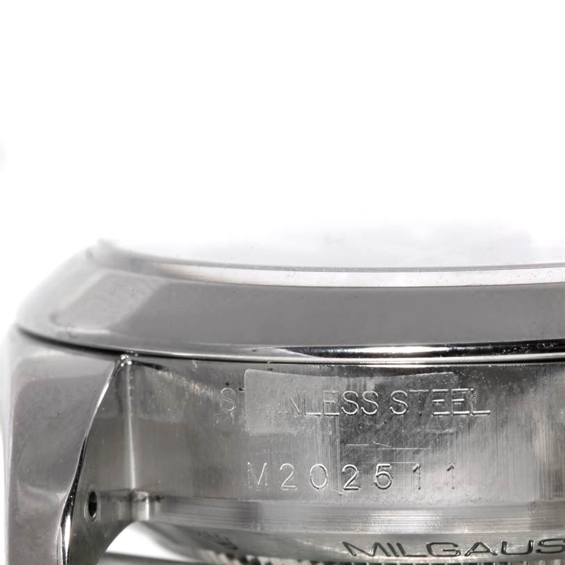 The image shows a close-up of the side of a Rolex Milgauss 116400 Men
s Stainless Steel Black Dial 116400 Men
s Stainless Steel Black Dial watch case with engraved serial numbers.