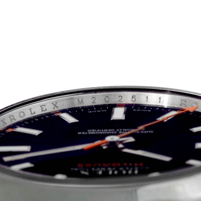The image shows a close-up, side angle of the Rolex Milgauss 116400 Men
s Stainless Steel Black Dial 116400 Men
s Stainless Steel Black Dial
 dial and inner bezel with part of the second hand.