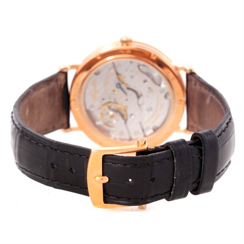 The image shows the back view of the Breguet Classique 5907BR/12/984 Men's Rose Gold Silver Dial 5907BR/12/984 Men's Rose Gold Silver Dial watch with parts of the strap and buckle visible.
