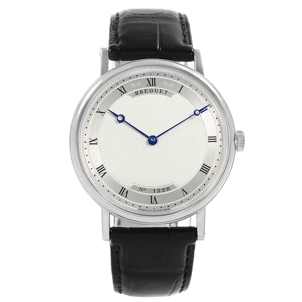 The image shows a front view of a Breguet Classique 5157BB/11/9V6 Men's White Gold Silver Dial 5157BB/11/9V6 Men's White Gold Silver Dial watch, highlighting its dial, hands, and black leather strap.