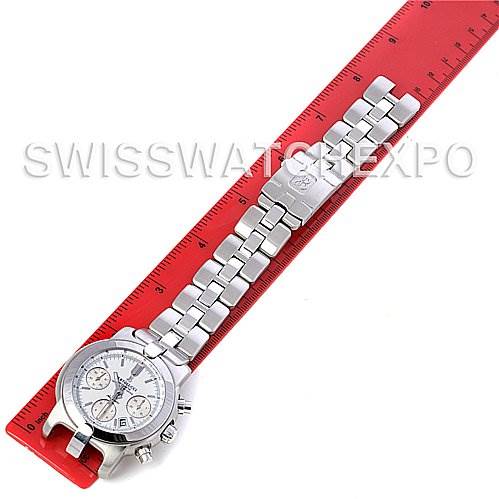 This image shows a Bertolucci Uomo Chronograph Stainless Steel Automatic Men's Watch by Breguet Men's Stainless Steel White Dial Men's Stainless Steel White Dial, laid flat on a red ruler.