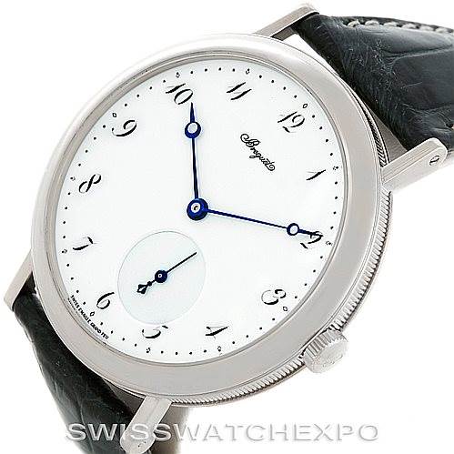 The image shows a Breguet Classique 5140BB/29/9W6 Men's White Gold White Dial 5140BB/29/9W6 Men's White Gold White Dial watch from a slightly tilted angle, highlighting the dial, case, and side crown.