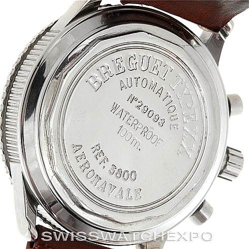 The image shows the back case of a Breguet Type XX model watch, highlighting the engravings and leather strap attachment.