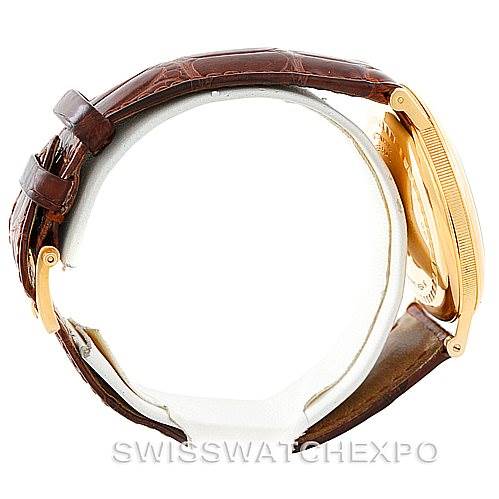 This image shows a side view of the Breguet Classique 5140BA/29/9W6 Men's Yellow Gold White Dial 5140BA/29/9W6 Men's Yellow Gold White Dial watch, highlighting its case and leather strap.