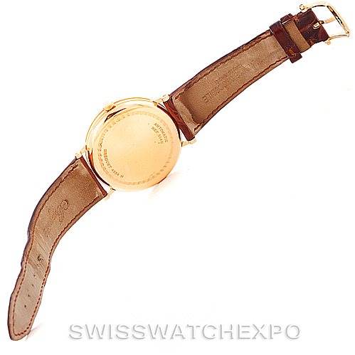 The image shows the back view of a Breguet Classique 5140BA/29/9W6 Men's Yellow Gold White Dial 5140BA/29/9W6 Men's Yellow Gold White Dial watch, highlighting its case back and leather strap.