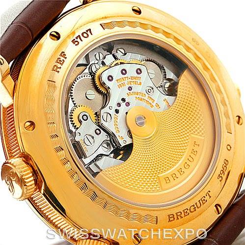 The image shows the back of a Breguet Classique 5707 Men's Yellow Gold Silver Dial 5707 Men's Yellow Gold Silver Dial watch, highlighting the intricate internal movement and gears.
