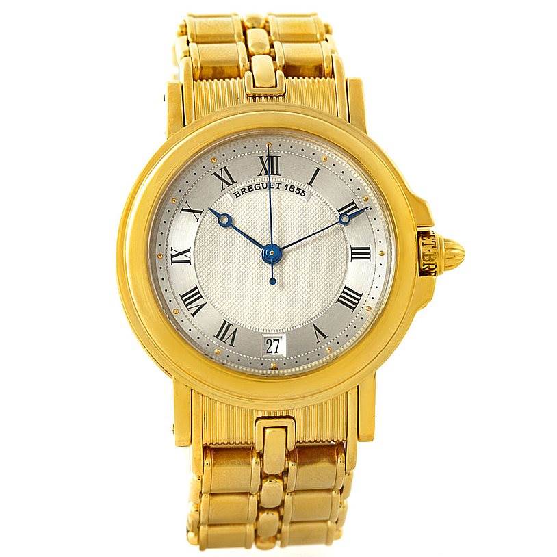 The watch is a Classique model by Breguet, shown from a front angle, displaying its face, hands, bezel, and bracelet.