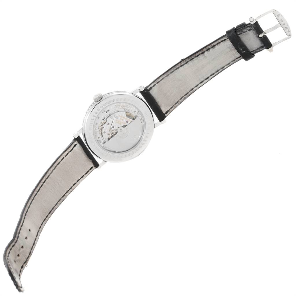 The image shows the back view of a Breguet Classique 5157 Men's White Gold Silver Dial 5157 Men's White Gold Silver Dial watch, displaying its open case back and leather strap.