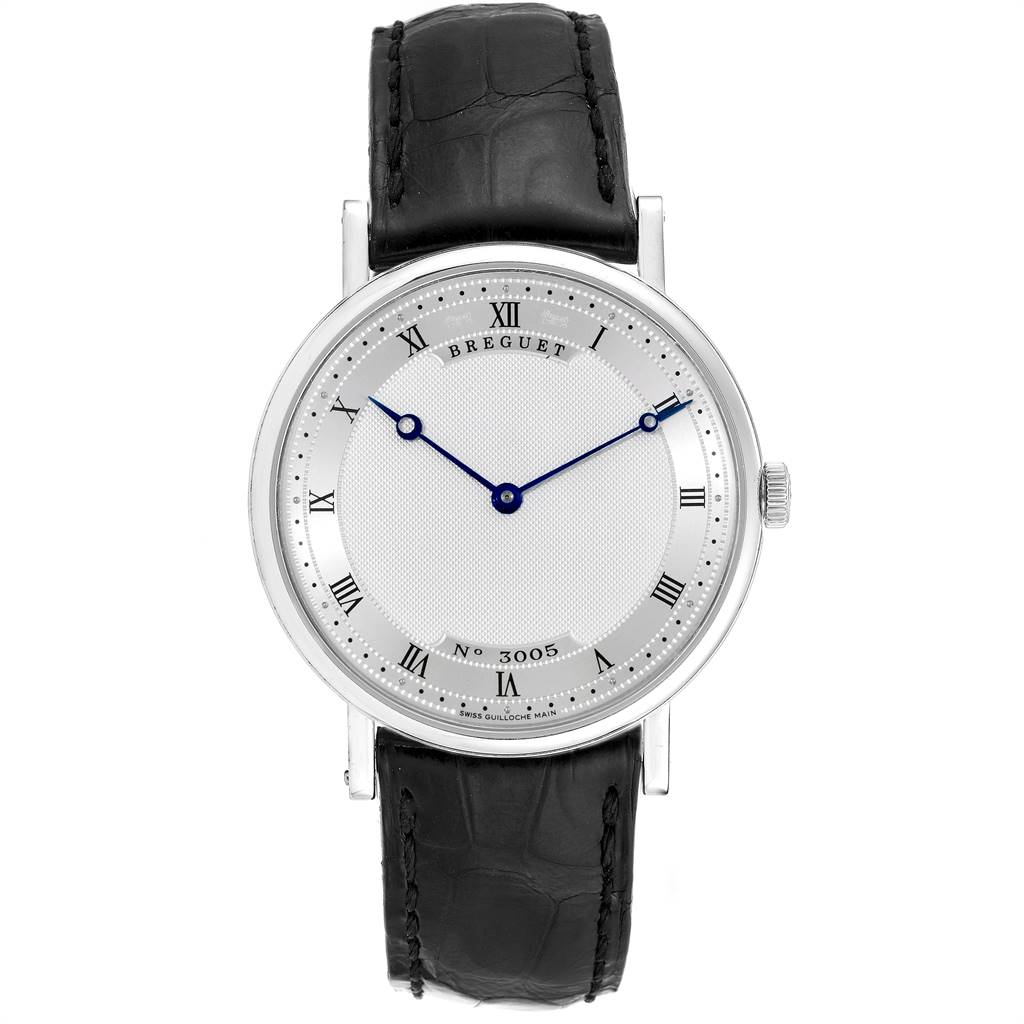 The image shows a front view of a Breguet Classique 5157 Men's White Gold Silver Dial 5157 Men's White Gold Silver Dial model watch, highlighting its face, Roman numerals, hands, and black leather strap.
