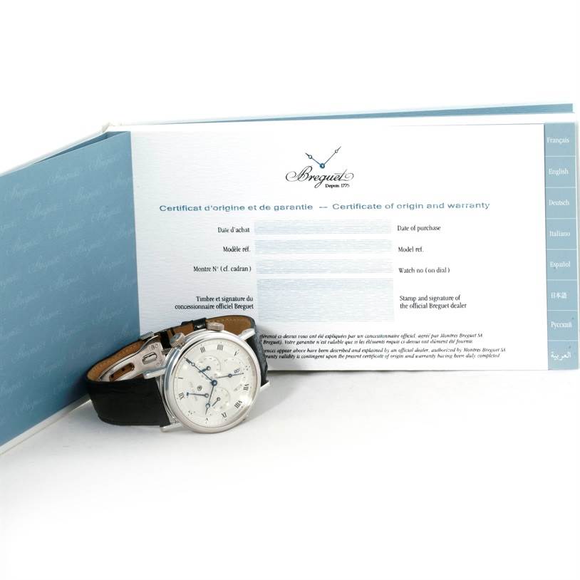 The image shows a Breguet Classique 5707 Men's White Gold Silver Dial 5707 Men's White Gold Silver Dial watch with a certificate of origin and warranty, viewed from a slight angle.