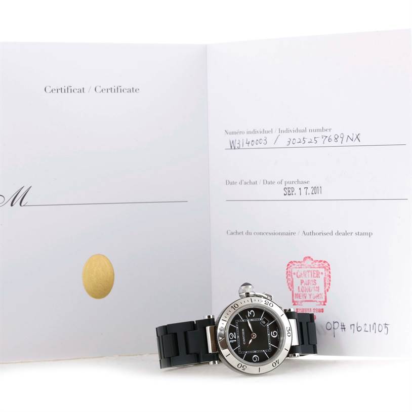 The Cartier Pasha W3140003 Women's Stainless Steel Black Dial W3140003 Women's Stainless Steel Black Dial watch is shown at an angle with its certificate, displaying the face, bezel, and part of the strap.