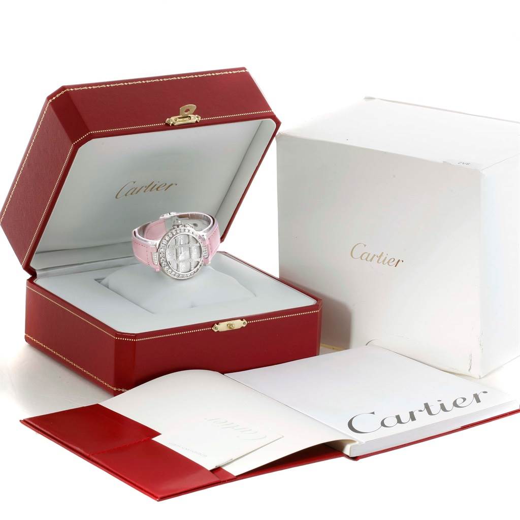 The Cartier Pasha WJ116136 Men's White Gold Silver Dial WJ116136 Men's White Gold Silver Dial watch is shown from a front angle in its box, alongside its outer packaging and accompanying documents.