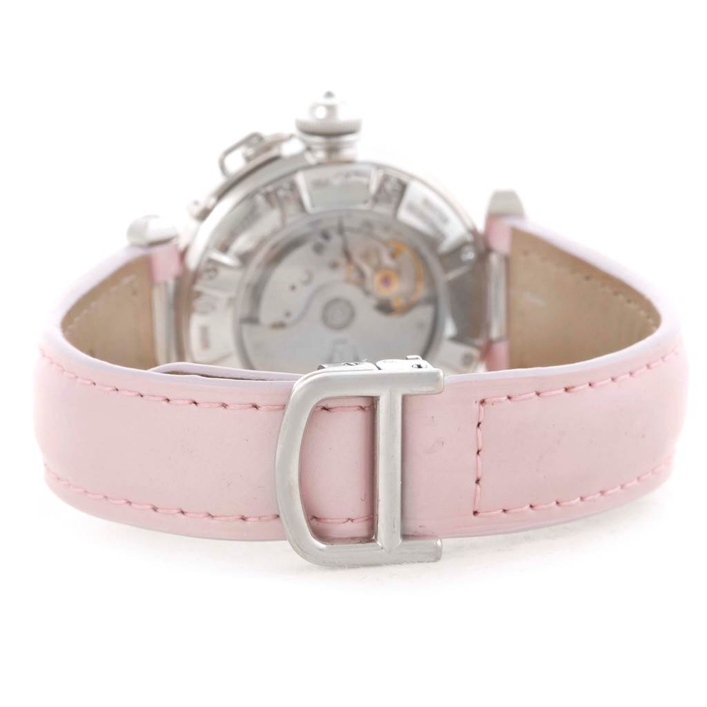 The image shows the back view of a Cartier Pasha WJ116136 Men's White Gold Silver Dial WJ116136 Men's White Gold Silver Dial watch, focusing on its movement and pink leather strap with a buckle.