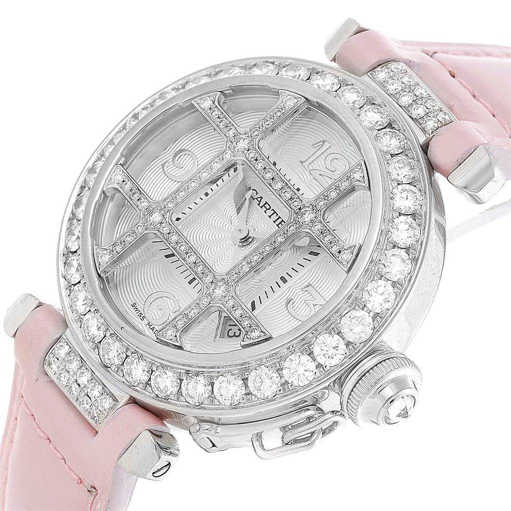 The image shows an angled close-up of a Cartier Pasha WJ116136 Men's White Gold Silver Dial WJ116136 Men's White Gold Silver Dial watch featuring a diamond-studded bezel and a pink strap.