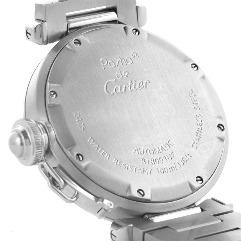 The image shows the case back of the Cartier Pasha W31058M7 Women
s Stainless Steel Pink Dial W31058M7 Women
s Stainless Steel Pink Dial watch, displaying its engravings and part of the bracelet clasp.