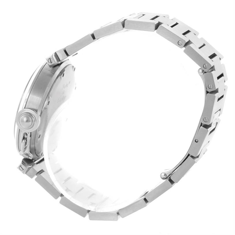 The image shows a side view of a Cartier Pasha W31058M7 Women
s Stainless Steel Pink Dial W31058M7 Women
s Stainless Steel Pink Dial watch, displaying the crown and the metal bracelet.