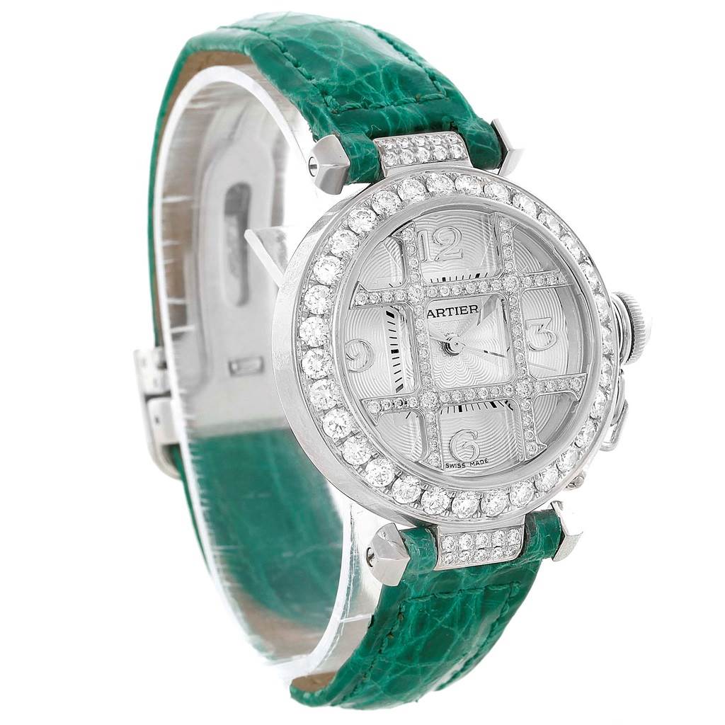This image shows a Cartier Pasha WJ116136 Men's White Gold Silver Dial WJ116136 Men's White Gold Silver Dial watch at a three-quarter angle, displaying its green strap, diamond bezel, and face details.