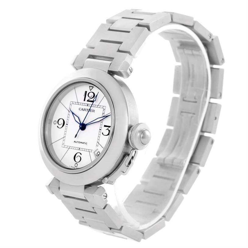 The image shows a Cartier Pasha W31074M7 Women's Stainless Steel White Dial W31074M7 Women's Stainless Steel White Dial model watch from a three-quarter angle, highlighting the face, bezel, bracelet, and crown.