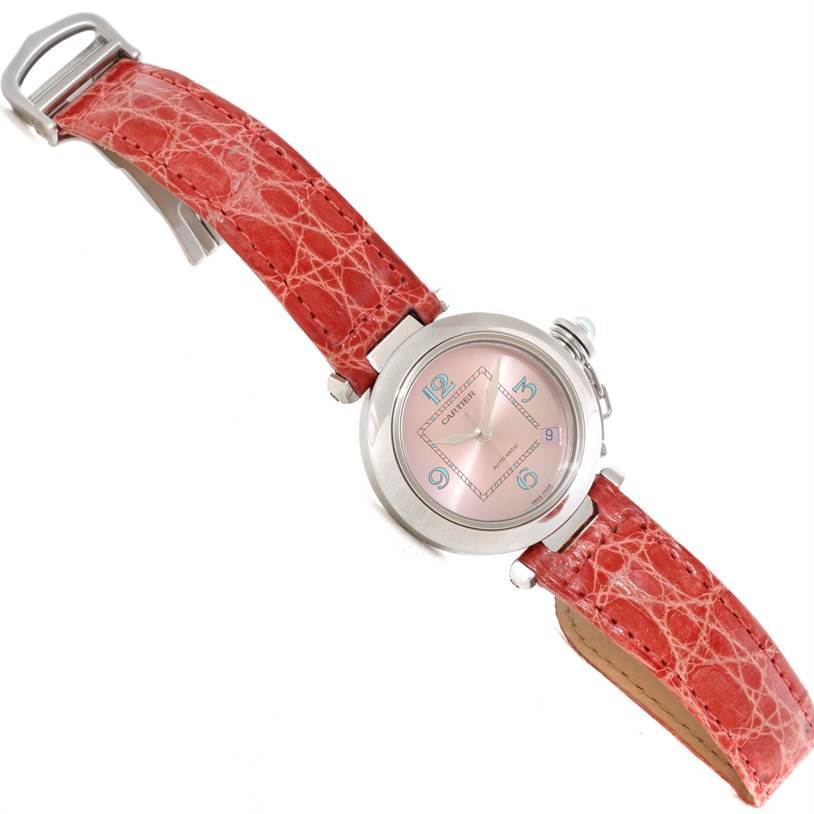 The image shows a Cartier Pasha W3108199 Women's Stainless Steel Pink Dial W3108199 Women's Stainless Steel Pink Dial watch at a slight angle, highlighting its red leather strap and pink dial.
