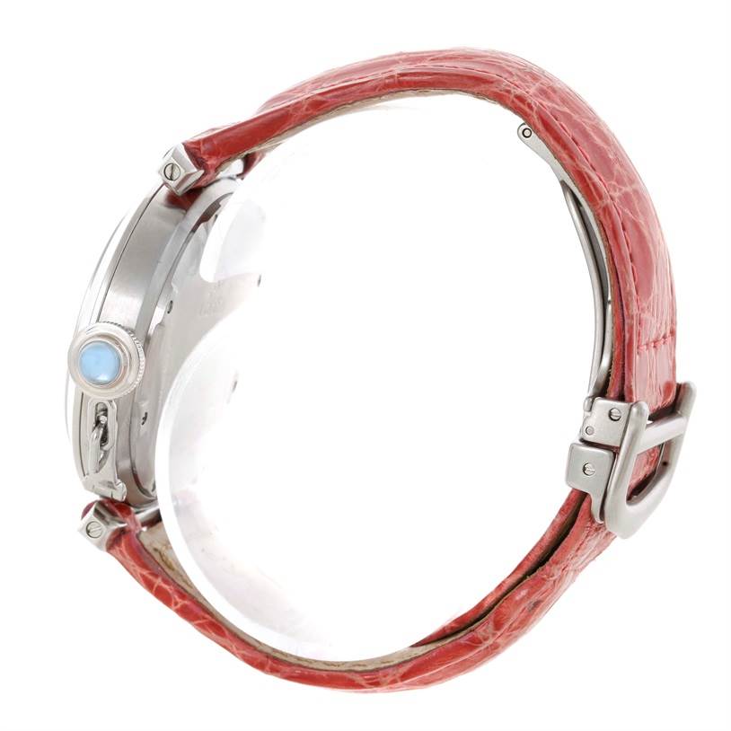 This image shows a side view of the Cartier Pasha W3108199 Women's Stainless Steel Pink Dial W3108199 Women's Stainless Steel Pink Dial watch highlighting its red leather strap and silver case.