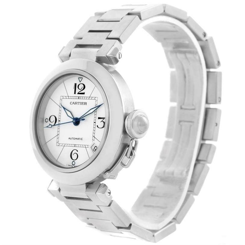The Cartier Pasha W31074M7 Stainless Steel White Dial W31074M7 Stainless Steel White Dial watch is shown from a front-left angle, displaying the face, crown, and metal bracelet.