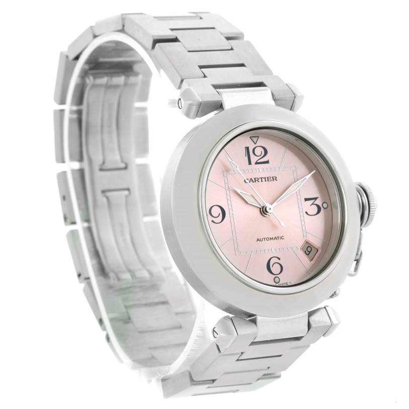 The Cartier Pasha W31075M7 Women's Stainless Steel Pink Dial W31075M7 Women's Stainless Steel Pink Dial watch is shown at a three-quarter angle, displaying its pink dial, metal bracelet, and crown.