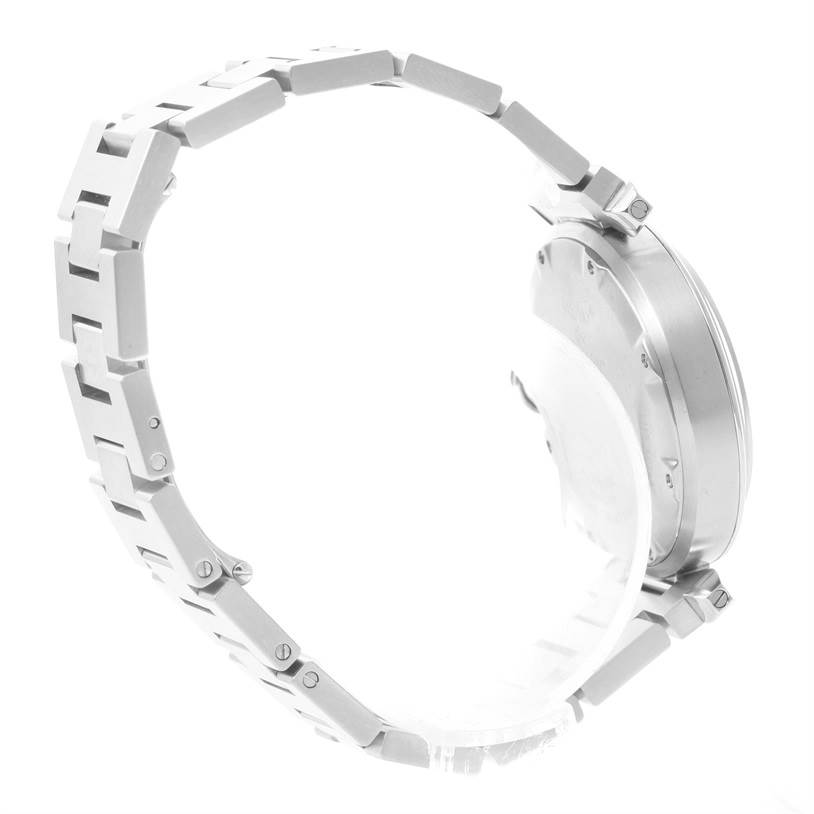 The image shows a side view of the bracelet and the case back of a Pasha model watch by Cartier.